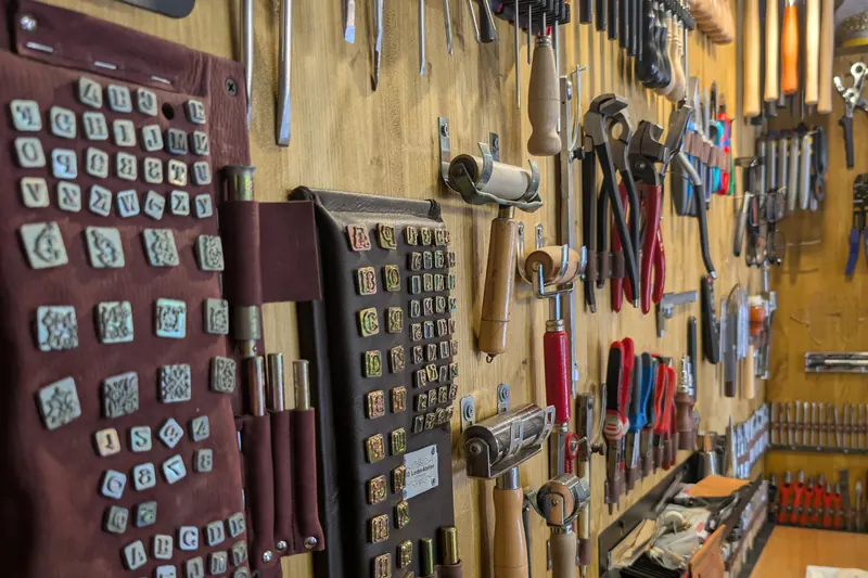 Stamps and tools on the workshop wall